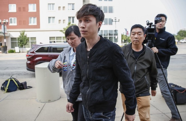 Parents Lifeng Ye (L), Ronggao Zhang (R) and brother Zhengyang Zhang (C) of Yingying Zhang arrive at the US Courthouse as jury selection in the federal trial of Brendt Christensen begins in the 2017 disappearance and suspected killing of Yingying Zhang, a visiting scholar from China whose body has not been found on June 3, 2019 in Peoria, Illinois. [Photo: AFP]