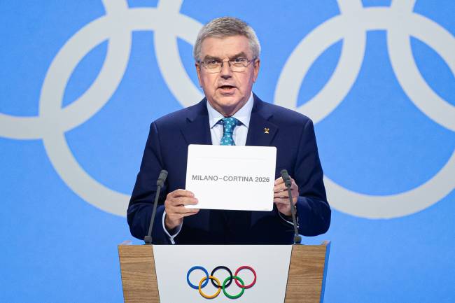 Thomas Bach, IOC president, announces the winner Milano Cortina during the election of the host city for the Olympic Winter Games 2026 at the 134th IOC Session on June 24, 2019 in Lausanne. [Photo: IC]