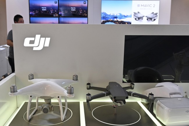 DJI drones are seen in a DJI store in Shanghai on May 22, 2019. [Photo: AFP]