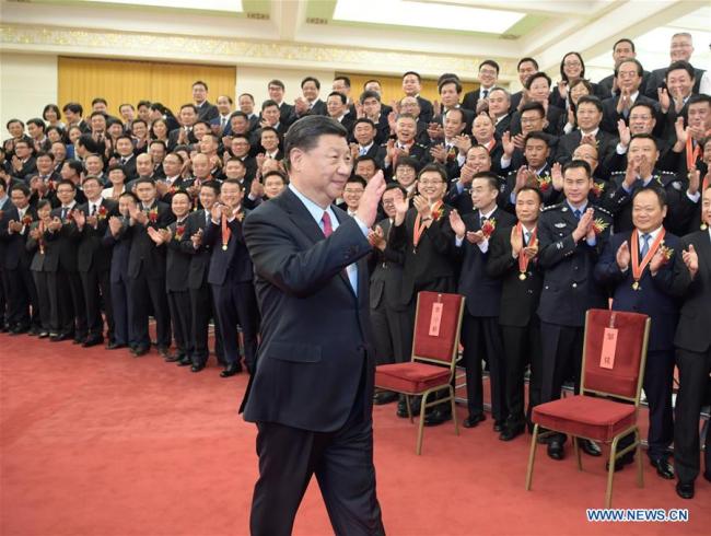 Chinese President Xi Jinping meets with representatives of model civil servants who are in Beijing to attend a national awarding ceremony in Beijing, on June 25, 2019. [Photo: Xinhua]<br><br>
