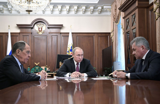 Russia's President Vladimir Putin (C) attends a meeting with Russia's Foreign Minister Sergei Lavrov (L) and Defence Minister Sergei Shoigu in Moscow on February 2, 2019. President Putin on February 2 said Russia was suspending its participation in the Intermediate-Range Nuclear Forces (INF) Treaty in a mirror response to a US move the day before. [File photo: Sputnik/AFP/Alexey Nikolsky]