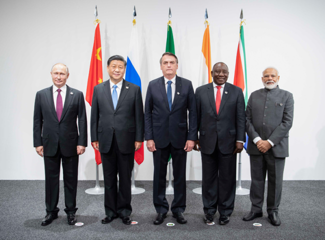 Chinese President Xi Jinping (2nd L) meets with Brazilian President Jair Bolsonaro (C), Russian President Vladimir Putin (1st L), Indian Prime Minister Narendra Modi (1st R) and South African President Cyril Ramaphosa (2nd R) at a BRICS leaders meeting on the sidelines of a summit of the Group of 20 (G20) major economies in Osaka, Japan, June 28, 2019.
