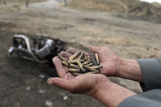 An Afghan security force hold bullet shell a day after an attack near the Bagram Air Base, north of Kabul, Afghanistan, Tuesday, April 9, 2019. Three American service members and a U.S. contractor were killed when their convoy hit a roadside bomb on Monday near the main U.S. base in Afghanistan, the U.S. forces said. The Taliban claimed responsibility for the attack. [File Photo: IC]