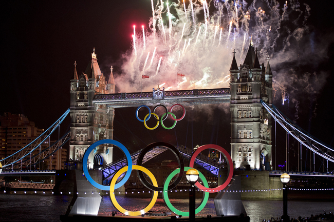 In this file photo taken on July 27, 2012 fireworks explode above Tower Bridge in London to celebrate the opening of the London 2012 Olympic Games.. London's iconic Tower Bridge celebrates its 125th anniversary on Sunday by showing off the weird and wacky alternative designs that were nearly built instead.[Photo: AFP/Johannes EISELE]