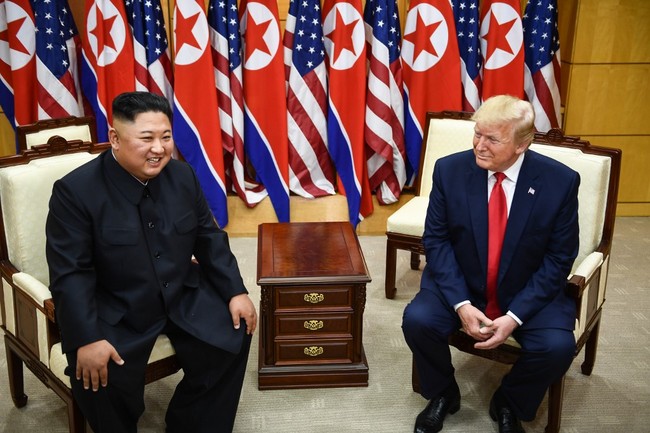 DPRK leader Kim Jong Un (L) and US President Donald Trump attend a meeting on the south side of the Military Demarcation Line that divides North and South Korea, in the Joint Security Area (JSA) of Panmunjom in the Demilitarized zone (DMZ) on June 30, 2019. [Photo: AFP]