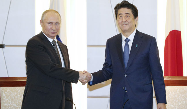 Japanese Prime Minister Shinzo Abe (R) holds talks with Russian President Vladimir Putin, in Osaka, Japan, on June 29, 2019. [Photo: IC]