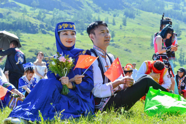 People attend a group wedding at the Kanas scenic area in Aletai, northwest China's Xinjiang Uygur Autonomous Region, July 1, 2019. [Photo: IC]