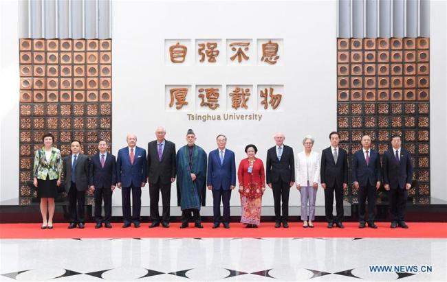 Chinese Vice President Wang Qishan (C) poses for a group photo with guests before the opening ceremony of the eighth World Peace Forum at Tsinghua University in Beijing, capital of China, July 8, 2019. [Photo：Xinhua]