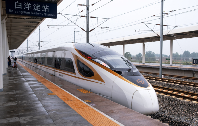 A high-speed train from Tianjin Municipality to Hong Kong stops at the Baiyangdian Station in the Xiongan New Area, Hebei Province, on July 10, 2019. [Photo: IC]