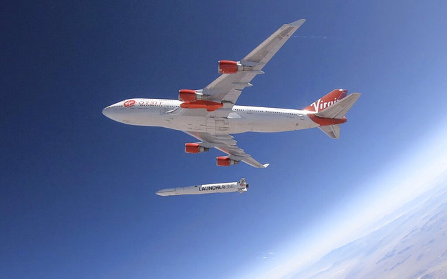 In this photo provided by Virgin Orbit, a rocket is dropped from a Boeing 747 airplane flying above Edwards Air Force Base in California, Wednesday, July 10, 2019. [Photo: Greg Robinson/Virgin Orbit via AP]