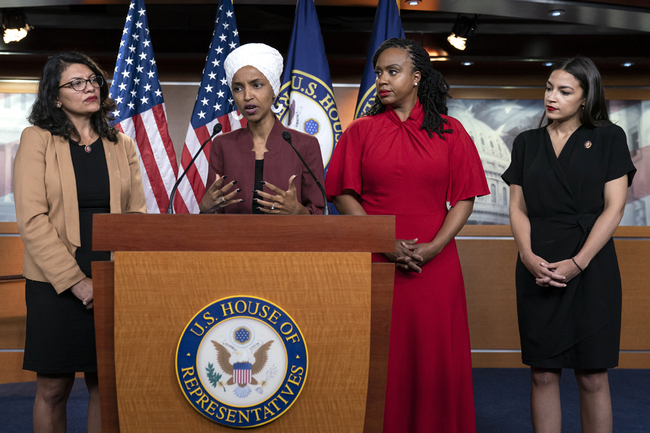 From left, U.S. Reps. Rashida Tlaib, D-Mich., Ilhan Omar, D-Minn., Ayanna Pressley, D-Mass., and Alexandria Ocasio-Cortez, D-N.Y., respond to base remark by President Donald Trump after he called for four Democratic congresswomen of color to go back to their "broken" countries, as he exploited the nation's glaring racial divisions once again for political gain, during a news conference at the Capitol in Washington, July 15, 2019. [Photo: IC]