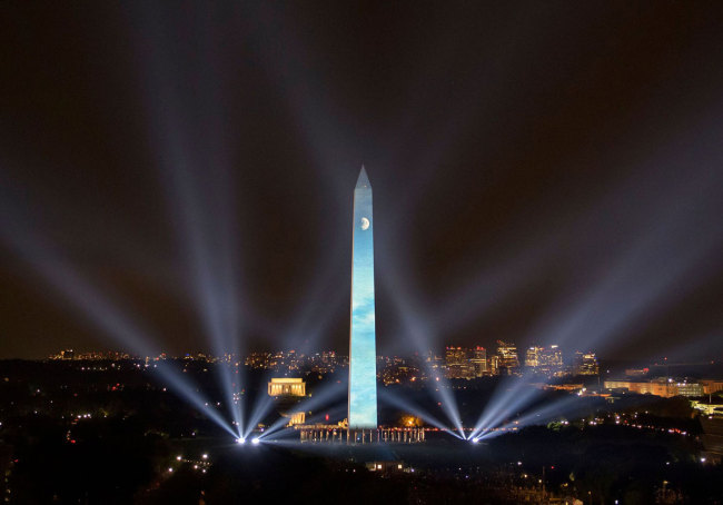 This handout photo released by NASA shows the 50 year anniversary of the Apollo 11 mission being celebrated in the "Apollo 50: Go for the Moon" show, which combined full-motion projection-mapping artwork on the Washington Monument and archival footage to recreate the launch of Apollo 11, July 19, 2019 in Washington, DC. [Photo: IC]<br><br>