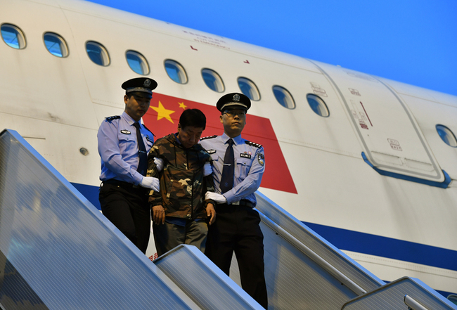 Liu Changkai, one of China's most wanted fugitives, returns to China and turns himself in to the police, on August 31, 2017, in Beijing. [File Photo: IC]