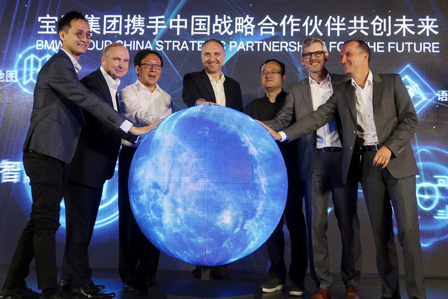 Jochen Goller (C), head of BMW's China operations, and other executives attend an event announcing the German automaker's partnership with China's Tencent Holdings in launching a computing center for self-driving vehicles, in Beijing on July 19, 2019. [Photo: VCG/Norihiko Shirouzu]