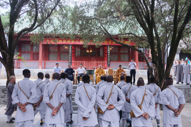 African apprentices listen to a speech during the opening ceremony of the seventh Shaolin Martial Art African Apprentice Class on Monday, July 22, 2019. [Photo: IC]