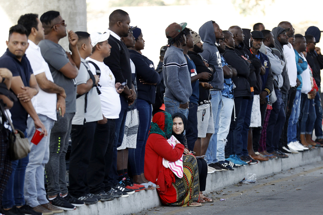 People wait to apply for asylum in the United States along the border, July 16, 2019, in Tijuana, Mexico. [Photo: IC]