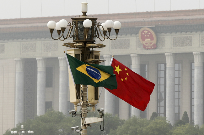 Chinese and Brazilian national flags flutter in front of the Great Hall of the People in Beijing, September 1, 2017. [File Photo: AP via IC]