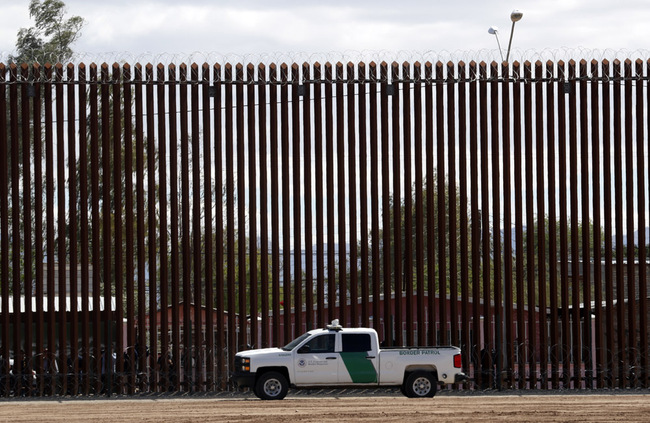 In this April 5, 2019, file photo, a U.S. Customs and Border Protection vehicle sits near the wall as President Donald Trump visits a new section of the border wall with Mexico in El Centro, Calif. The Supreme Court has cleared the way for the Trump administration to tap Pentagon funds to build sections of a border wall with Mexico. [Photo: AP/Jacquelyn Martin]