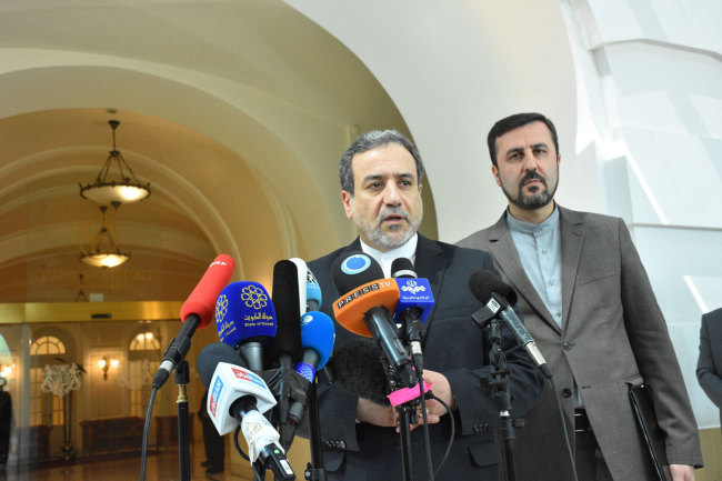 Iranian Deputy Foreign Minister Abbas Araghchi (L) makes a speech after attending Joint Comprehensive Plan of Action (JCPOA) meeting on Iran nuclear program under the presidency of EU director Helga Schmid (not seen) in Vienna, Austria on July 28, 2019. [Photo: IC]<br>