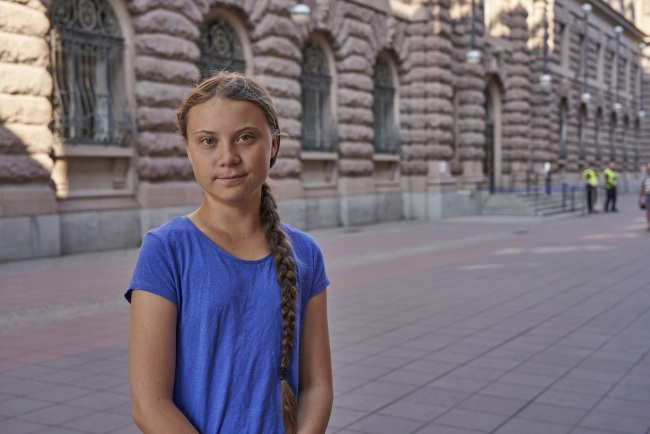 In this photo taken on Friday, July 26, 2019, Greta Thunberg stands next to Swedish parliament in Stockholm. [Photo: AP]