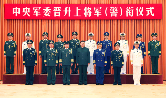 Xi Jinping (C, front), chairman of the Central Military Commission (CMC), and other leaders pose for a group photo with ten senior Chinese military and armed police officers who have been promoted to the rank of general in Beijing, capital of China, July 31, 2019. Xi presented the officers with certificates of order signed by him at a ceremony the CMC held in Beijing on Wednesday. [Photo: Xinhua]