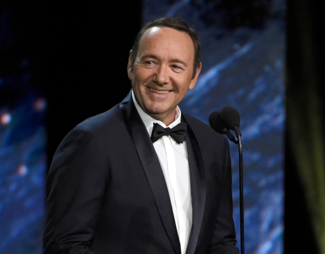FILE - In this Oct. 27, 2017 file photo, Kevin Spacey presents the award for excellence in television at the BAFTA Los Angeles Britannia Awards in Beverly Hills, Calif. Spacey has made his first public appearance since being accused of sexual assault, reading a poem about a worn-out boxer in a Rome museum. Standing next to a Greek bronze statue of a battered boxer in the National Roman Museum on Friday, Aug. 2, 2019, Spacey dramatically intoned Italian poet Gabriele Tinti’s poem ‘’The Boxer,’’ about a fighter left bleeding at ringside, cast aside despite previous glory. [Photo: AP/Chris Pizzello/Invision]