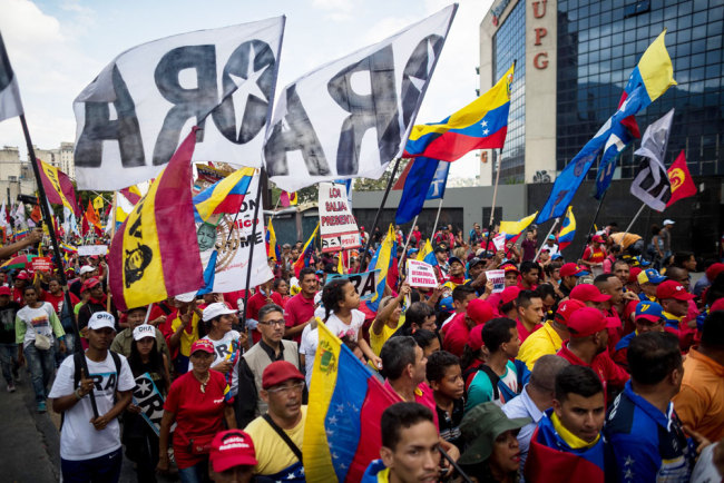 Thousands of people participate in a march in Caracas, Venezuela, on August 7, 2019 to protest fresh moves by the U.S. to freeze all Venezuelan government's assets in the United States and block transactions with its authorities. [Photo: EFE via IC/Miguel Gutierrez]