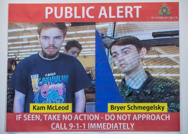 In this July 23, 2019 file photo, security camera images of fugitives Kam McLeod, 19, and Bryer Schmegelsky, 18, are displayed during a news conference in Surrey, British Columbia. [Photo: Darryl Dyck/The Canadian Press via AP]