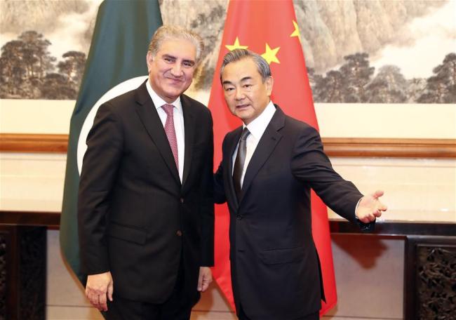 Chinese State Councilor and Foreign Minister Wang Yi (R) holds talks with Pakistani Foreign Minister Shah Mahmood Qureshi in Beijing, capital of China, Aug. 9, 2019. Qureshi is in China on a special and emergency visit. [Photo: Xinhua/Ding Lin]