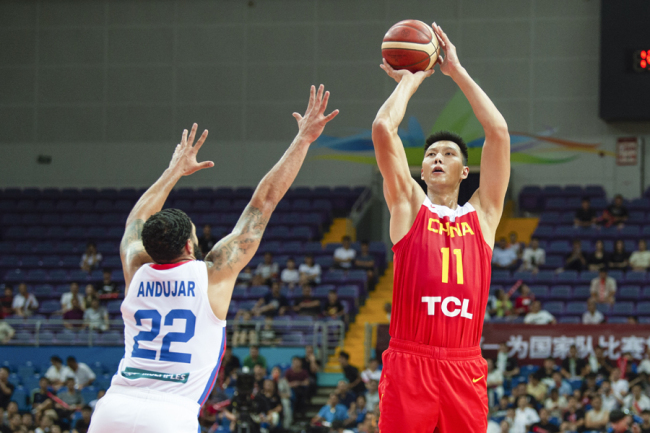 Yi Jianlian (No.11) shoots the ball during the basketball game between China and Porto Rico in Kunshan, Jiangsu Province on Aug 12, 2019. [Photo: IC]