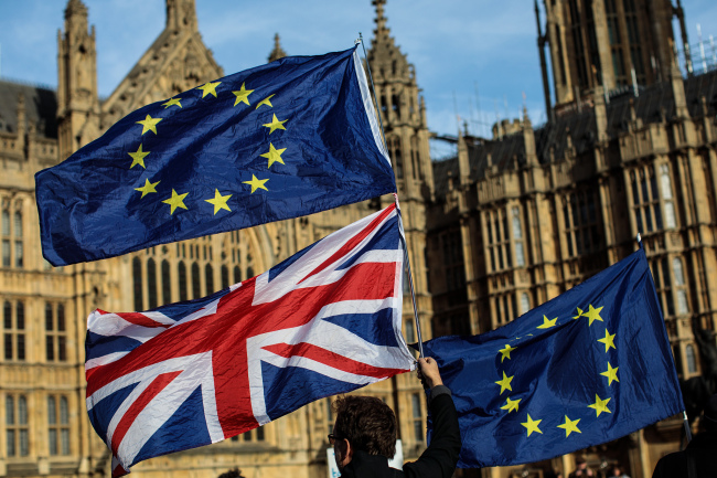  Pro-EU protesters demonstrate against Brexit with flags outside the House of Parliament on November 13, 2018 in London, England. [File photo: VCG]