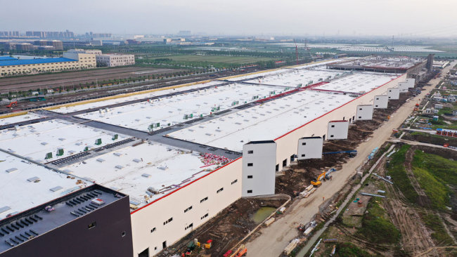 U.S. electric car maker Tesla's first overseas Gigafactory is under construction in the new Lingang area of the Shanghai Pilot Free Trade Zone. [File photo: VCG]