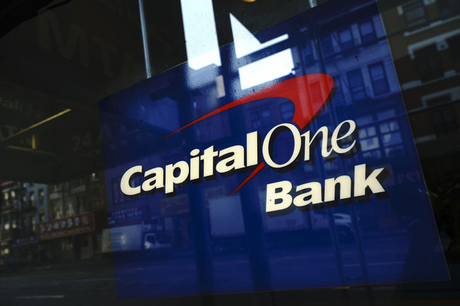 Capital One signage adorns a window of a Capital One bank in the Lower East Side of Manhattan on July 30, 2019 in New York City. [Photo: VCG]<br>