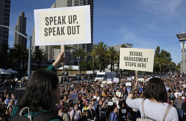 In this Nov. 1, 2018, file photo, Google employees hold up signs during a walkout rally at Harry Bridges Plaza in San Francisco to protest against what they said is the tech company's mishandling of sexual misconduct allegations against executives. [Photo: AP]