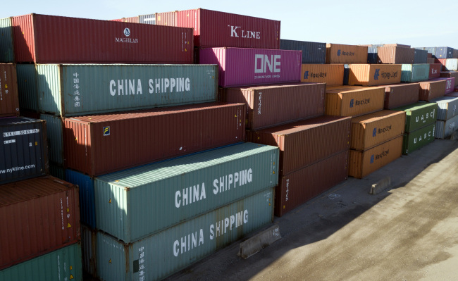 China Shipping Company and other containers are stacked at the Virginia International's terminal in Portsmouth, United States, on May 10, 2019. [File photo: AP/Steve Helber]