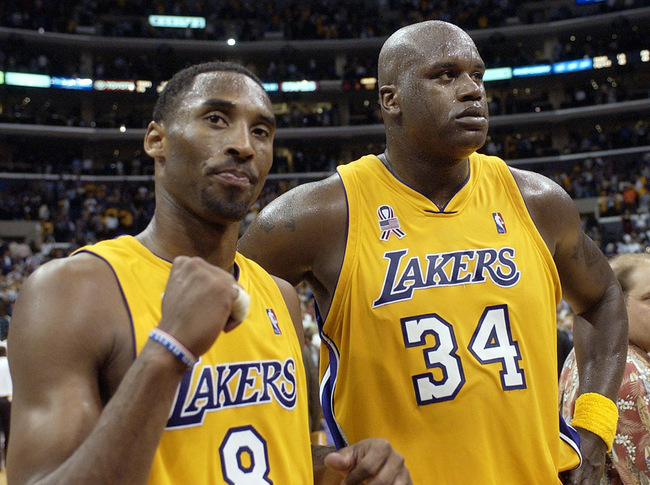 In this May 4, 2002, file photo, Los Angeles Lakers' Kobe Bryant, left, and Shaquille O'Neal celebrate after winning Game 5 of the Western Conference semifinals against the San Antonio Spurs, in Los Angeles. Bryant downplayed talk of a reignited feud with Shaquille O'Neal, saying there is "nothing new" that has been said recently between the former teammates. Bryant had recently said that if O'Neal had worked harder, they could have won 12 rings together with the Los Angeles Lakers. O'Neal fired back on social media that they could have won more if Bryant had passed him the ball more often. But Bryant said Thursday, Aug. 29, 2019, during a visit to the U.S. Open tennis tournament that the comments don't mean they are fighting again. [Photo: AP/Mark J. Terrill]