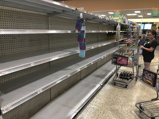 Photo: Store shelves are empty of bottled water as residents buy supplies in preparation for Hurricane Dorian, in Doral, Fla., Thursday, July 29, 2019. [Photo: AP/Marcus Lim]