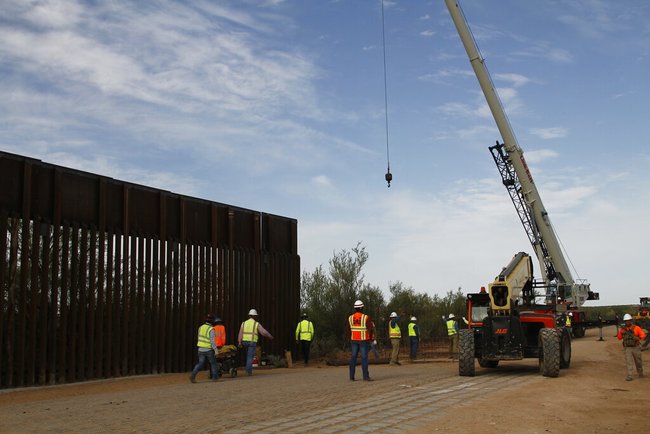 In this Aug. 23, 2019 file photo, workers break ground on new border wall construction about 20 miles west of Santa Teresa, N.M. [File photo: AP]