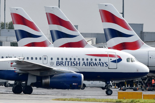 British Airways passenger aircraft are pictured at London Heathrow Airport in London on May 3, 2019. [File Photo: AFP/Ben Stansall]