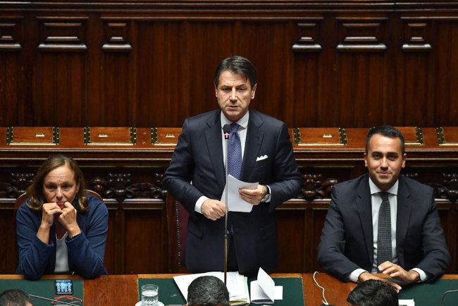 Italian premier Giuseppe Conte (C), flanked by Interior Minister Luciana Lamorgese (L) and Foreign Minister Luigi Di Maio (R) during his second address to the Lower House ahead of a confidence vote, in Rome, Italy, September 9, 2019. [Photo: EPA via IC/Alessandro Di Meo]