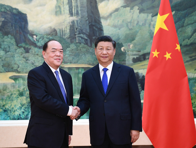 President Xi Jinping (right) meets with Ho Iat Seng, the newly elected and appointed chief executive of the Macao Special Administrative Region at the Great Hall of the People in Beijing on September 11, 2019. [Photo: Xinhua]