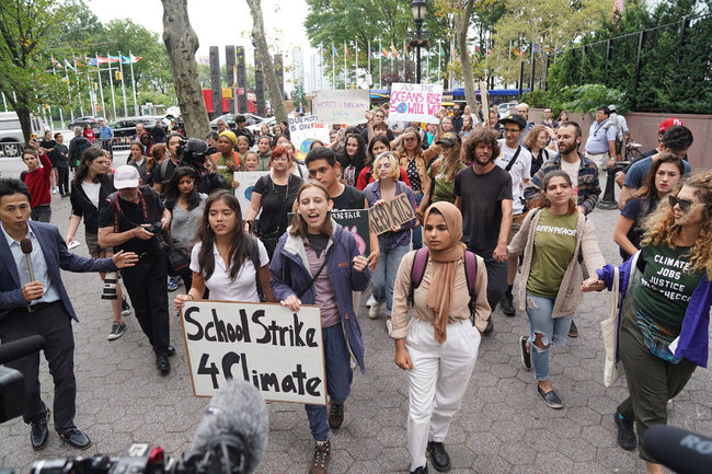 Students march outside the United Nations during a protest against climate change on September 6, 2019 in New York. [Photo: AFP]