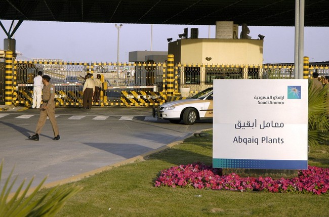 In this file photo taken on February 25, 2006 Saudi security guard the entrance of the oil processing plant of the Saudi state oil giant Aramco in Abqaiq in the oil-rich Eastern Province. [File Photo: AFP]