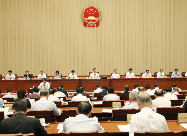 Li Zhanshu, chairman of the National People's Congress (NPC) Standing Committee, presides over the opening session of a one-day special session of the NPC Standing Committee to review a draft decision on conferring national medals and honorary titles on Tuesday, September 17, 2019. [Photo: Xinhua]