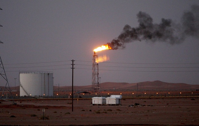 An image showing a gas flame behind pipelines in the desert at Khurais oil field, about 160 km from Riyadh, Kingdom of Saudi Arabia, June 23, 2008 (reissued May 14, 2019). Reports on May 14, 2019 state Saudi Aramco said some of its oil infrastructure in Saudi Arabia's eastern province has been attacked, including one of its petroleum pumping stations that was targeted by apparent armed drone attack. [EPA via IC/ALI HAIDER]