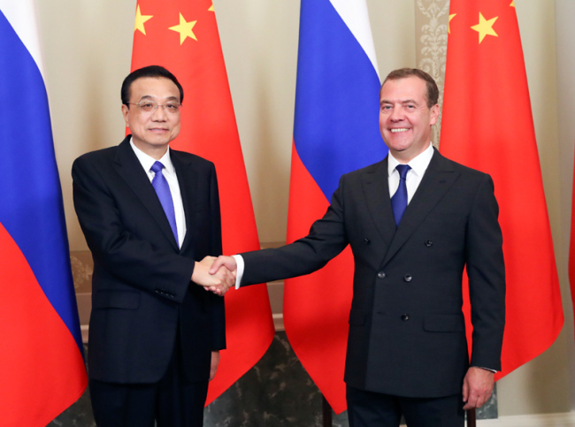 Chinese Premier Li Keqiang (L) and his Russian counterpart Dmitry Medvedev co-chair the 24th regular meeting between Chinese and Russian heads of government in St. Petersburg, Russia on Tuesday, September 17, 2019. [Photo: Xinhua]