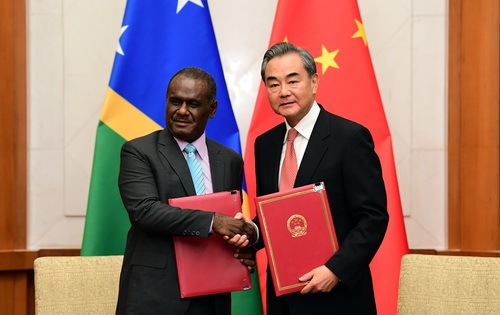 Chinese State Councilor and Foreign Minister Wang Yi (R) and Solomon Islands' Minister of Foreign Affairs and External Trade Jeremiah Manele sign a joint communique on the establishment of diplomatic relations after their talks in Beijing, on Saturday, September 21, 2019. [Photo: fmprc.gov.cn]