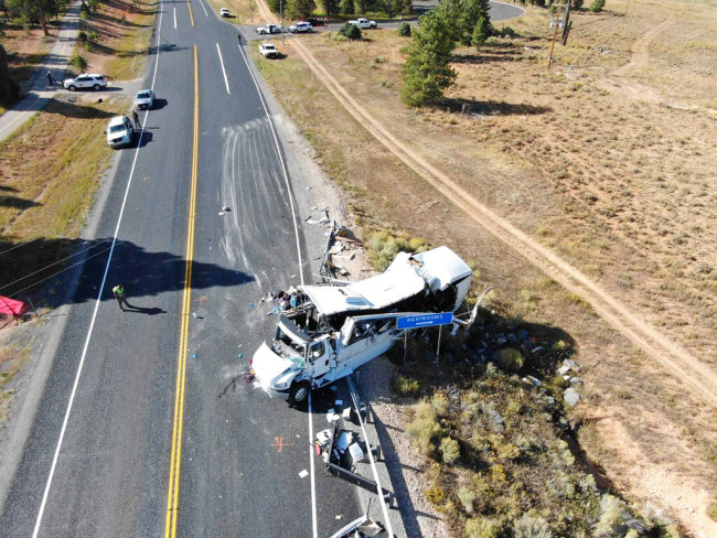 This photo provided by the Utah Highway Patrol shows a tour bus carrying Chinese-speaking tourists after it crashed near Bryce Canyon National Park in southern Utah, killing at least four people and critically injuring multiple others, Friday, Sept. 20, 2019. [Photo: Utah Highway Patrol via AP]