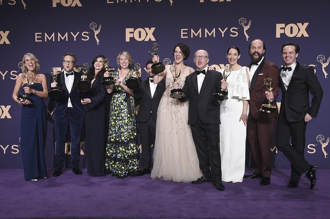 Harry Bradbeer, fourth from right, winner of the award for outstanding directing for a comedy series, and the cast and crew of "Fleabag," winners of the award for outstanding comedy series, pose in the press room at the 71st Primetime Emmy Awards on Sunday, Sept. 22, 2019, at the Microsoft Theater in Los Angeles. [Photo: AP via IC/Jordan Strauss]