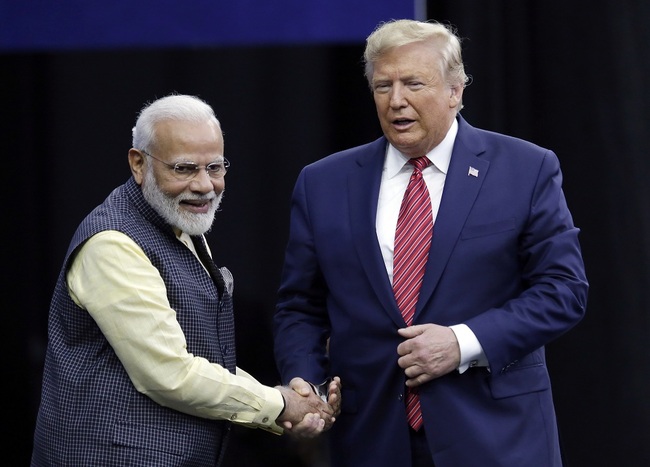 Indian Prime Minister Narendra Modi and U.S.  President Donald Trump shake hands after introductions during the "Howdi Modi" event Sunday, Sept. 22, 2019, at NRG Stadium in Houston. [Photo: AP via IC/Michael Wyke]